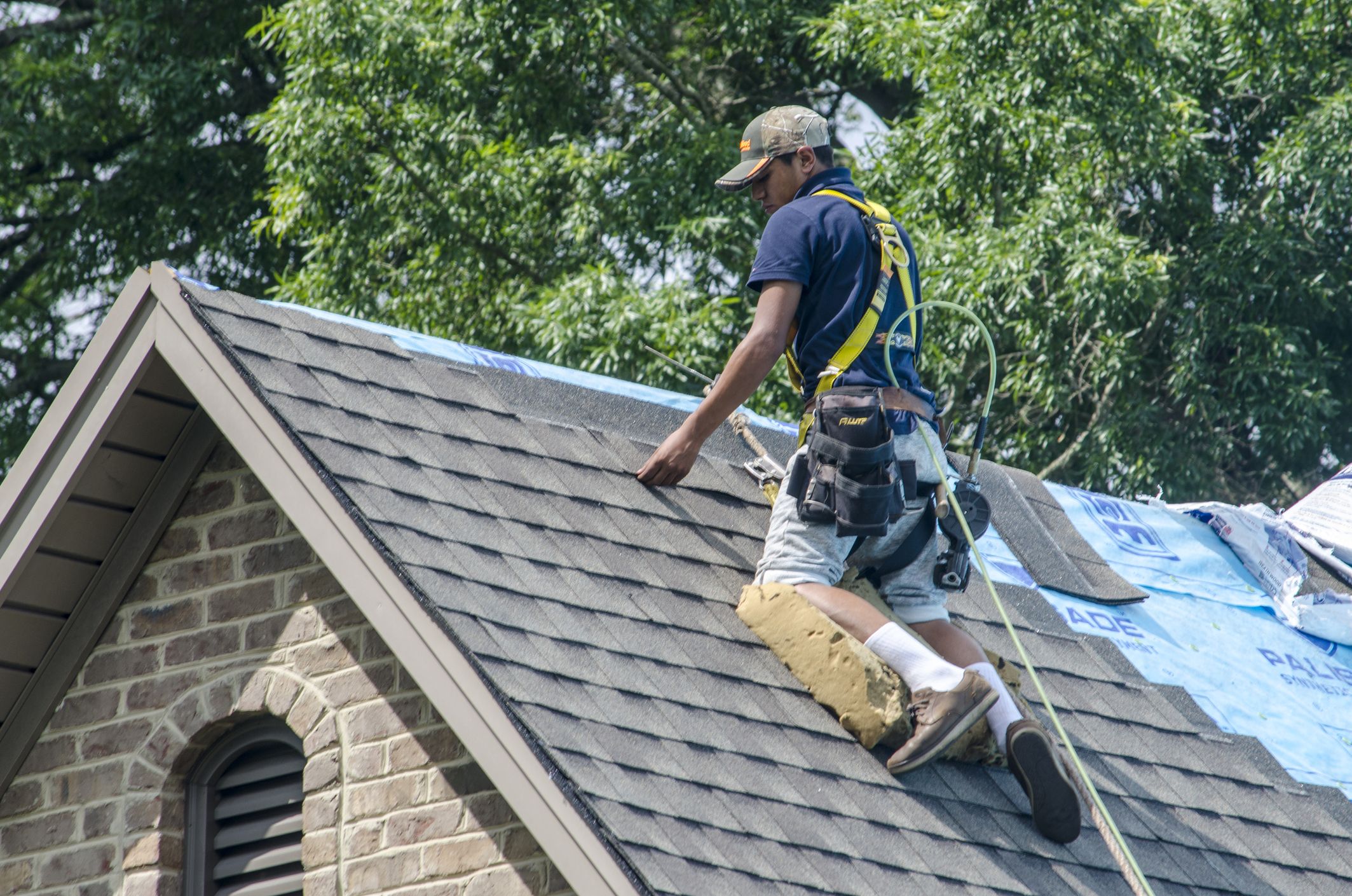 A roofing Person is Working Residential Property - Think SEO Now